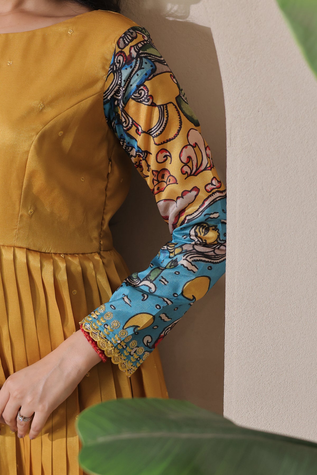 stunning flared yellow gown with pen kalamkari design