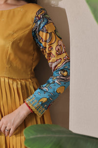 stunning flared yellow gown with pen kalamkari design