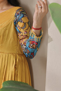 stunning flared yellow gown with pen kalamkari design