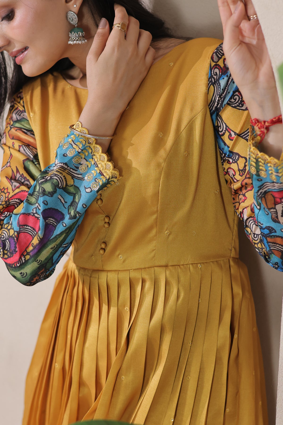 stunning flared yellow gown with pen kalamkari design