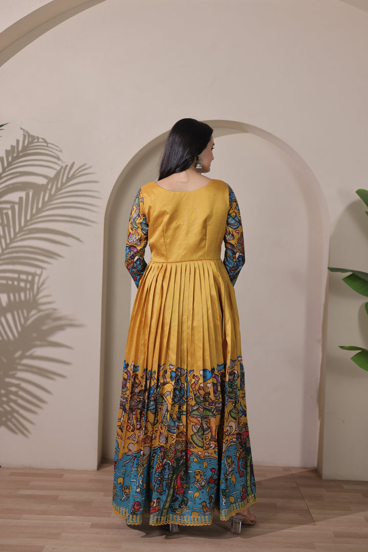 stunning flared yellow gown with pen kalamkari design